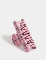 Broche para el pelo tipo pinza, de acrílico color rosa con diseño cuadrillé en tonos rosa y negro.
