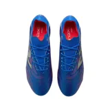 Championes de fútbol New Balance Tekela color azul con detalles en plateado y rojo.