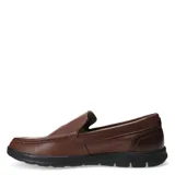 Zapato mocasín de cuero color marrón, con suela negra y detalle de costuras en la parte superior.