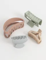 Set de cuatro broches para el pelo de diferentes formas y tamaños, en colores pastel: rosa, verde, beige y celeste.