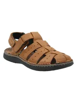 Sandalia de cuero color marrón con tiras enlazadas y ajuste de velcro.