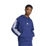 Buzo hoodie Adidas M 3S FT HD azul con capucha, bolsillo tipo canguro y logo de la marca bordado en el pecho. Presenta las tres tiras características de la marca en color blanco sobre las mangas.