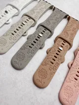 Correa de silicona para smartwatch con diseño de girasoles grabados.
