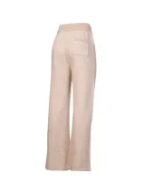 Pantalón de jogging tejido en tonos beige y crema, con cintura elástica con cordón ajustable y corte recto.