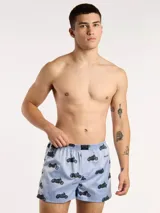 Bóxer de algodón con estampado floral en tonos azul y blanco, con cintura elástica y logo de la marca en el centro.