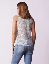 Blusa sin mangas de tul bordado con flores, escote en V y lazo.