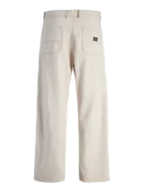 Pantalón de algodón color beige, de corte ancho, con bolsillos laterales y traseros. Presenta costuras contrastantes en color marrón.