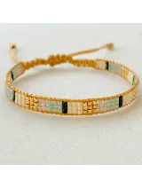 Pulsera tejida con cuentas originales MIYUKI en tonos de rosa, beige, dorado, verde y negro.