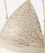 Top cropped femenino con escote en V, breteles finos ajustables y tejido cubierto de lentejuelas.