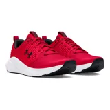 Championes Under Armour Charged Commit TR 4, color gris claro con logo negro y suela blanca.
