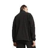 Campera de micropolar negro con cierre frontal, cuello alto y logo de Puma bordado en el pecho.