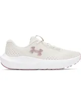 Championes Under Armour Charged Surge 4 para mujer, color blanco hueso con logo en rosa y suela blanca con detalles en rosa.