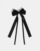 Hebilla para el pelo color negro con forma de moño con lazos largos.