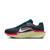 Championes de running Nike Air Winflo 11, color azul petróleo con detalles en rosa y suela amarilla.