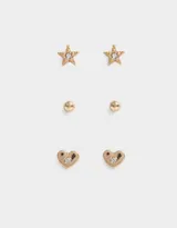 Set de tres pares de aros dorados con pasantes: un par con forma de estrella con strass, un par con forma de corazón con strass y un par de bolitas de metal.