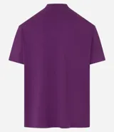 Remera blanca de algodón, corte holgado, cuello redondo alto, manga corta y sisas caídas.