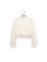 Blusa corta celeste de tejido arrugado liviano, con cuello mao, botones al frente, mangas abullonadas y ruedo elastizado.