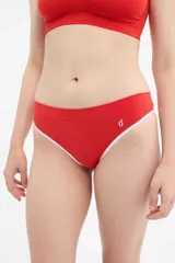 Colaless blanca con elástico negro en cintura y contorno de pierna.