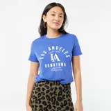 Remera azul con estampado blanco que dice 'Los Angeles Since 1990 LA Downtown American Club California'.