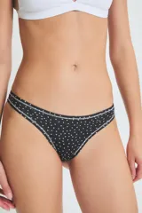 Bombacha vedetina negra con estampado de corazones blancos y ribete blanco.