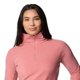 Buzo polar blanco de mujer, con cuello alto y cierre de media cremallera.