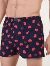 Bóxer de algodón con estampado floral en tonos azul y blanco, con cintura elástica y logo de la marca en el centro.