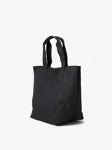 Bolso tote negro de lona de poliéster reciclado, con asas cortas y bolsillo frontal con etiqueta cuadrada tejida con el logo de Carhartt WIP.