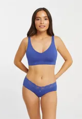 Bralette de lycra azul con copa interna removible, sin aro, breteles fijos regulables y cierre trasero de tres posiciones.