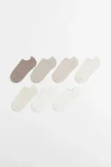 Pack de siete pares de soquetes invisibles en colores lisos: marrón, beige, crema y blanco.