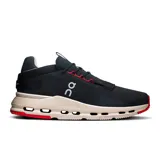 Championes urbanos negros con detalles en rojo y suela beige con tecnología CloudTec.