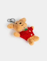 Llavero de peluche con forma de perro color beige, vestido con un sweater rojo y un collar de perlas.