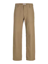 Pantalón chino color beige de pierna ancha, con cintura media y bajo doblado. Cierre con gancho y cremallera, bolsillos delanteros y traseros. Fit amplio en toda la pierna y muslos. Confeccionado en canvas, un tejido plano resistente que no se estira como los tejidos de punto.