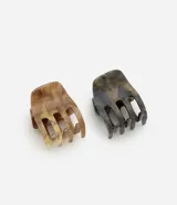 Set de dos pinzas para el pelo tipo garra, una color marrón marmolado y otra color gris marmolado con purpurina.