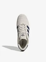 Championes Adidas Taekwondo Lace color crema con detalles en azul marino.