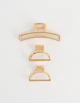 Set de tres broches metálicos dorados para el pelo, con diseño calado.