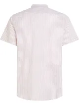 Camisa Tommy Hilfiger de corte regular, confeccionada en tejido mil rayas ligeramente elástico. Diseño a rayas verticales color blanco y rojo, cuello mao y logo de Tommy Hilfiger bordado en el pecho.