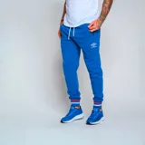 Pantalón de jogging azul con logo Umbro estampado en blanco, cintura elástica con cordón ajustable y puños ajustados con detalle de rayas rojas y blancas.