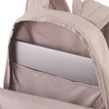 Mochila Puma modelo Buzz, color rosa viejo (beige rosado), con gran logo Puma en relieve en el panel frontal. Presenta un bolsillo frontal con cierre y bolsillos laterales de malla. La base de la mochila es de color negro.