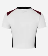 Blusa corta de algodón color blanco con mangas cortas, cuello redondo y bloques de colores en contraste en los laterales y en los hombros. Tiene lettering "NY - American Off Side" estampado en el pecho.