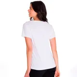 Remera blanca de algodón con cuello en V y logo de Caterpillar estampado en plateado.