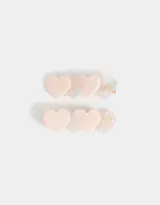 Set de dos hebillas para el pelo con apliques de corazón en tonos rosa y blanco.