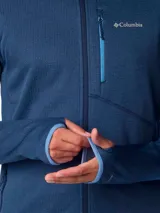 Campera polar Columbia Park View Fleece, color azul jaspeado, con cierre frontal completo, cuello alto, bolsillos laterales con cierre y bolsillo en el pecho con cierre vertical en color verde lima. Cuenta con tecnología Omni-Wick, puños elásticos con orificios para pulgares y protector de barbilla.