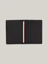 Billetera plegable de cuero negro con paneles de diferentes texturas y detalle de logo de Tommy Hilfiger en el frente.