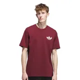 Remera de manga corta color bordó con logo Adidas Shmoo en el pecho.