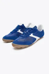 Zapatillas deportivas de estilo running, color azul con detalles en blanco y suela marrón.