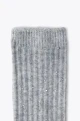 Calcetines altos negros con detalle de strass plateado.