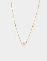 Cadena corta dorada con dije de flor con piedras de zirconia.