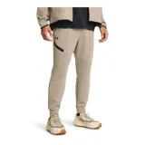 Pantalón de jogging gris de corte ajustado, con cintura elástica ajustable con cordón, bolsillos laterales con cierre y logo de Nike bordado en negro en la pierna izquierda.