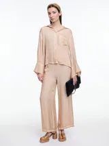 Pantalón amplio gris de viscosa teñida en frío, con efecto gastado, cintura elástica y calce relajado.