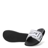 Sandalias Puma Royalcat Comfort 2, con base negra y tira ancha blanca con el logo de la marca en negro.